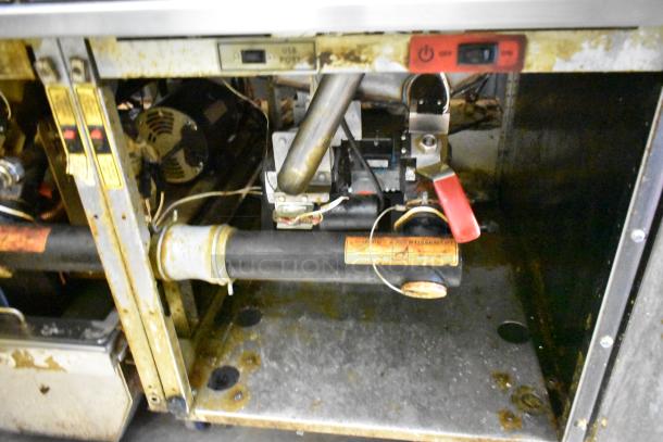 Vulcan 2TR65CF commercial fryer interior, showing filtration system components, natural gas connections, and worn condition.