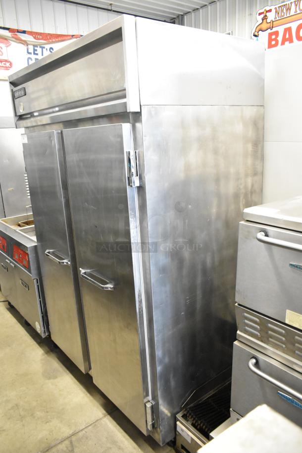 Continental 2R stainless steel commercial reach-in cooler, 2 doors, poly-coated racks, on casters, 115V, 1 phase.