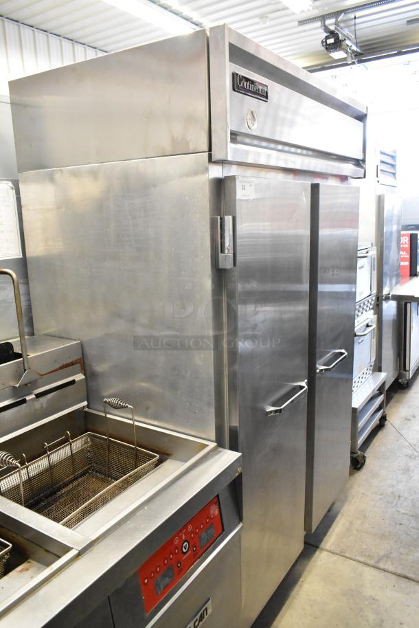 Continental 2R stainless steel 2-door commercial cooler, poly coated racks, on casters, 115V, 1 phase, excellent condition.