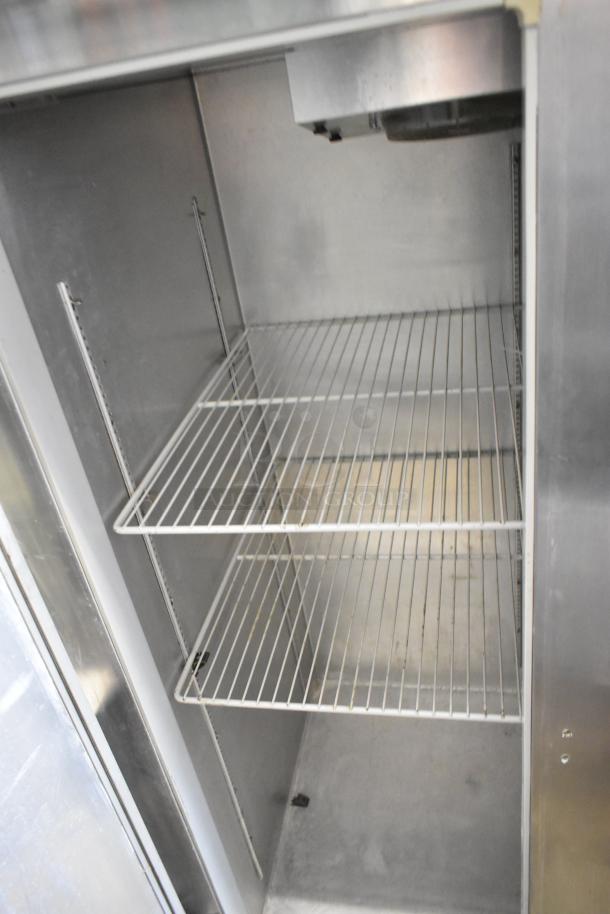 Continental 2R stainless steel commercial cooler, 2 doors, poly-coated racks, commercial casters, 115V, 1 phase.