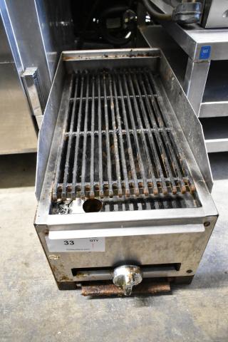 Stainless steel gas-powered charbroiler grill, commercial countertop model with visible wear and adjustable knob.
