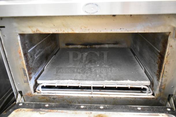 Two Turbochef NGC stainless steel rapid cook ovens on stand with casters, 208/240V, 1 phase. Interior shows wear.