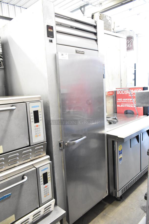 Traulsen G10010 stainless steel commercial cooler, single door, with poly coated racks and casters, 115V, 1-phase.