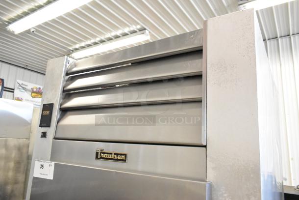 Traulsen G10010 stainless steel single door reach-in cooler with poly coated racks and commercial casters, 115V, 1 phase.