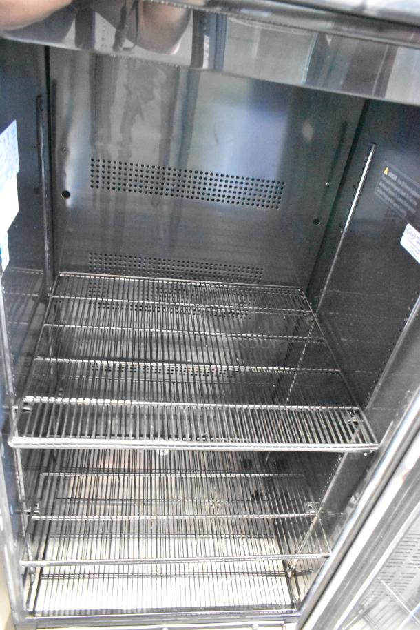 IDW GCG-10-F334B metal single door cooler with poly coated racks, interior view. Model GCG-10-F334B, 115 volts, 1 phase.