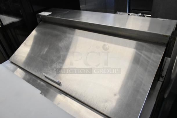 Everest EPR1 stainless steel sandwich prep table, mega top, on casters, 115V, 1 phase, commercial use, good condition.