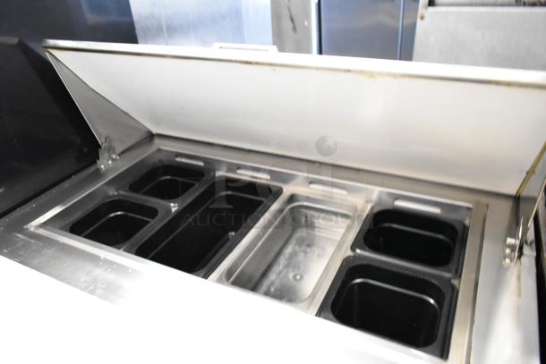 Everest EPR1 stainless steel sandwich prep table with bain marie top. Features multiple compartments, on commercial casters.