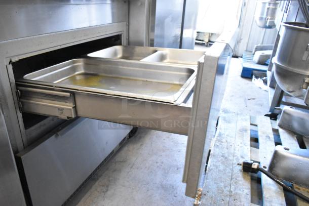 Randell 941452D7 stainless steel commercial sandwich prep table with 2 drawers, bain marie, on casters, 115V, 1 Phase.