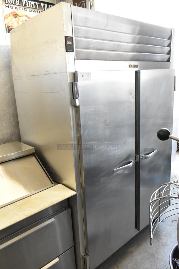 Traulsen G20010 stainless steel 2-door reach-in cooler with poly-coated racks, on commercial casters. 115V, 1 phase.