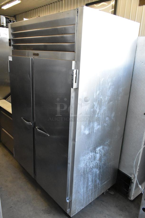 Traulsen G20010 stainless steel commercial 2-door cooler with poly coated racks on casters, 115V, in used condition.