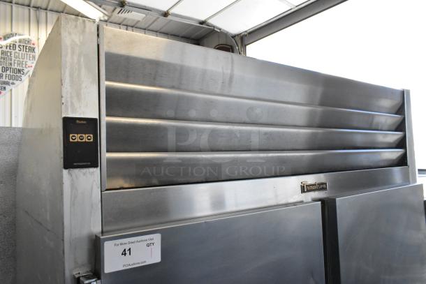 Traulsen G20010 stainless steel 2-door reach-in cooler with poly-coated racks, commercial casters, 115V, 1 phase.