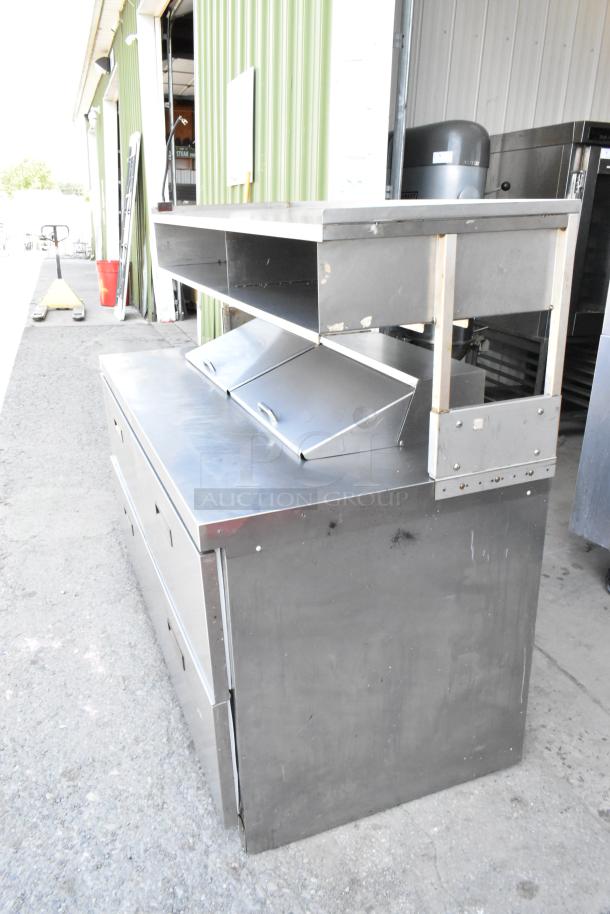 Delfield UCD4464N-12-DD stainless steel prep table with 4 drawers, overshelf, on casters. 115V, 1 phase.