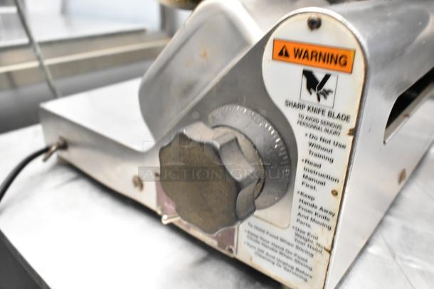 Globe 400 Stainless Steel Commercial Meat Slicer with blade sharpener, 115V, 1-phase. Warning label visible on side.