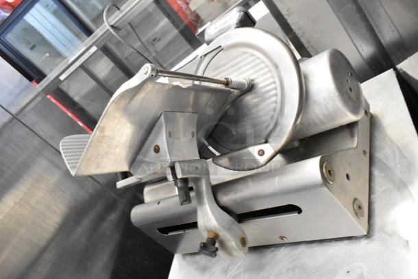 Globe 400 stainless steel commercial meat slicer with blade sharpener, 115V, 1 Phase. Used, good condition.