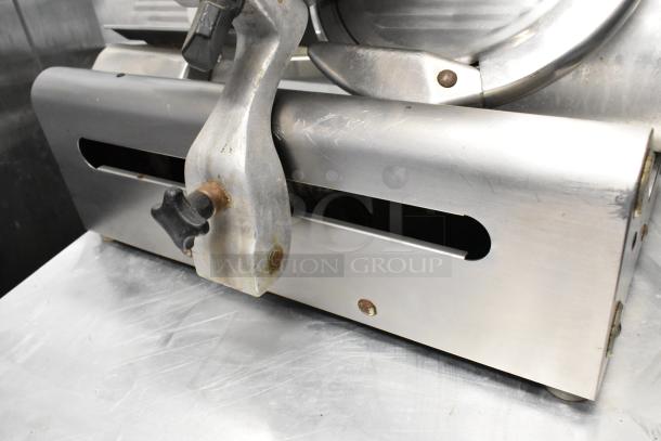 Globe 400 stainless steel commercial meat slicer with blade sharpener, 115 volts, 1 phase, good condition.