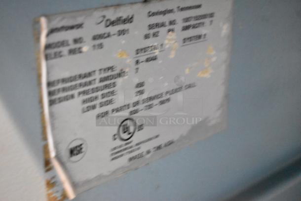 Delfield 406CA-DD1 label showing model and specifications, including 115 volts and refrigeration details.