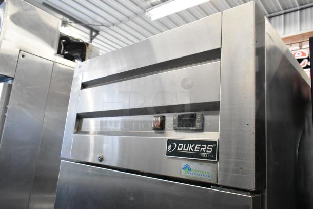 Dukers D28AF stainless steel commercial single door reach-in freezer with poly coated racks on casters; 115V, 1 Phase.