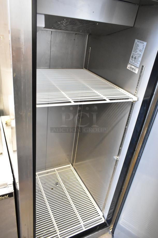 Dukers D28AF stainless steel single door commercial freezer with poly coated racks and commercial casters, 115V, 1 phase.