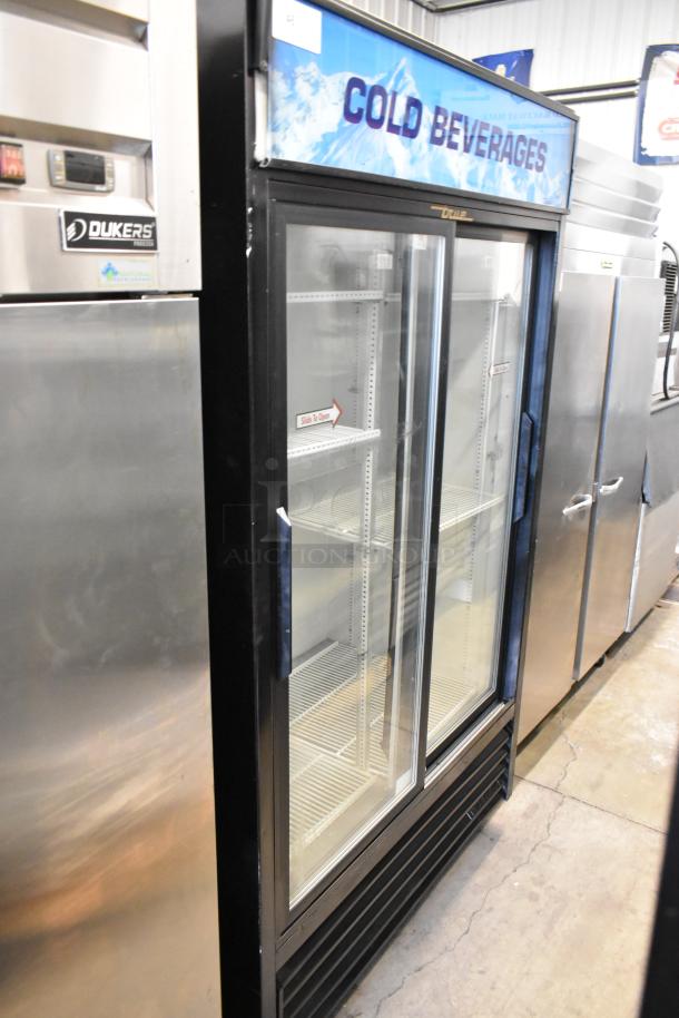 True GDM-41 metal commercial 2-door cooler, poly coated racks, commercial casters, 115 volts, 1 phase, "Cold Beverages" sign.