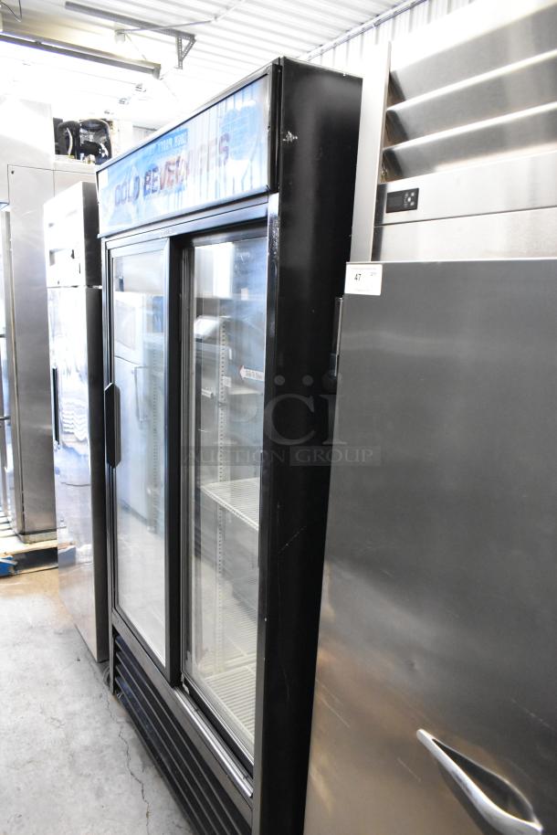 True GDM-41 commercial metal 2-door cooler with poly racks, on casters. 115V, 1 Phase, used condition.