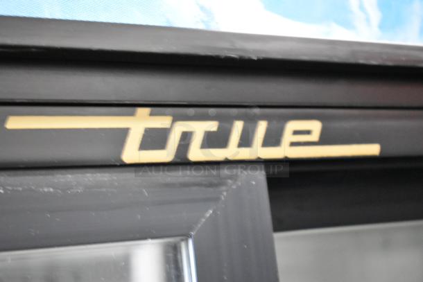 True GDM-41 commercial cooler, metal, 2-door, poly-coated racks, on casters, 115V, 1 phase, logo detail shown.