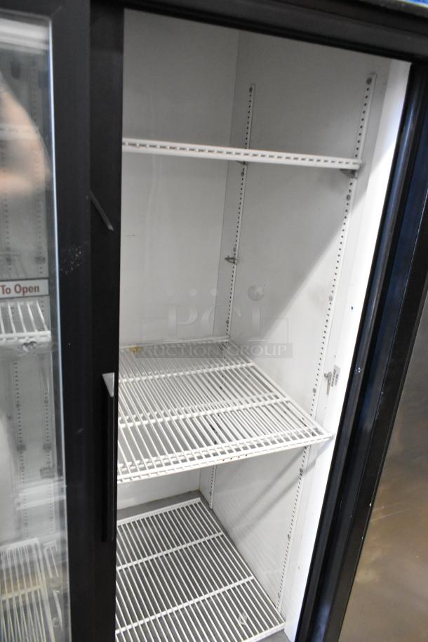 True GDM-41 commercial 2-door cooler, metal exterior, poly coated racks, on commercial casters, 115V, 1 phase.