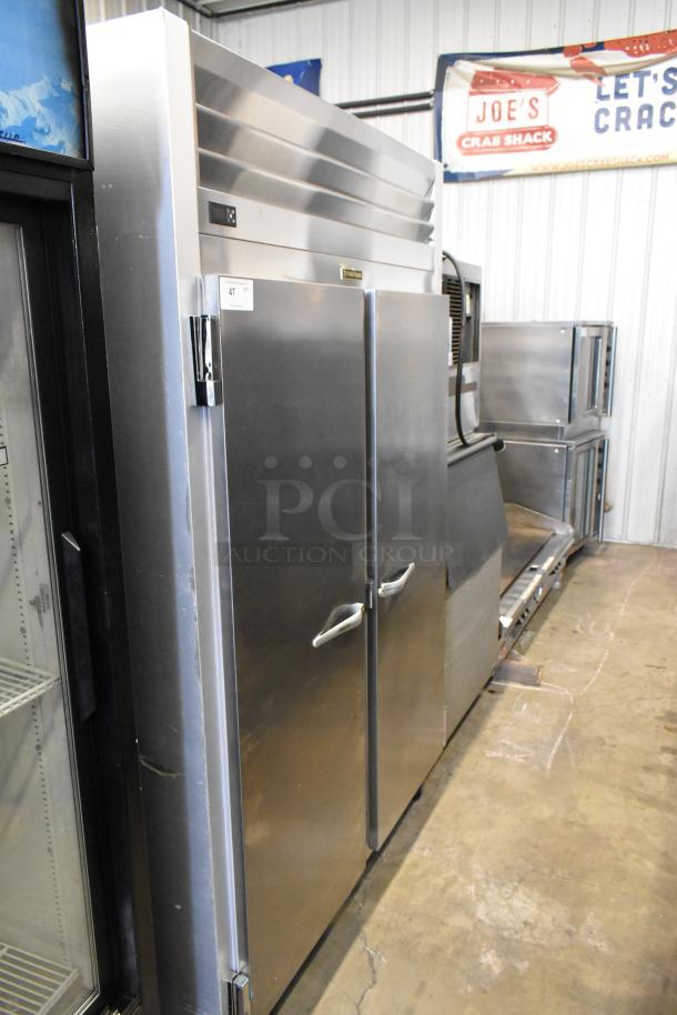 Traulsen G20010 stainless steel 2-door reach-in cooler, poly coated racks, on casters. 115 Volts, 1 Phase, commercial use.