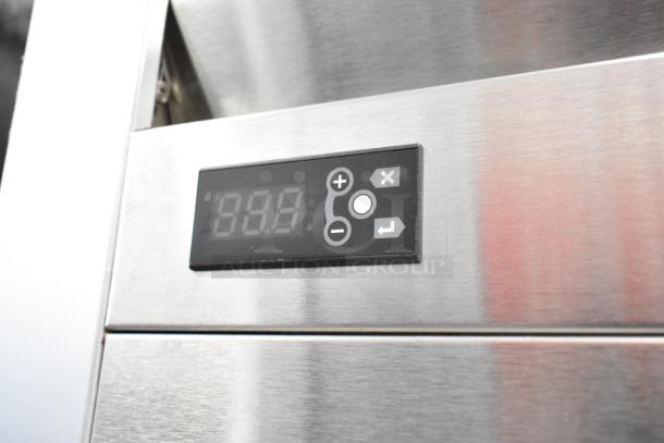 Traulsen G20010 stainless steel 2-door reach-in cooler with digital display, poly coated racks, and commercial casters.