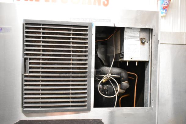 Hoshizaki KML-631MAH stainless steel commercial ice head with exposed internal components, mounted on an ice bin. 208-230V, 1-phase.