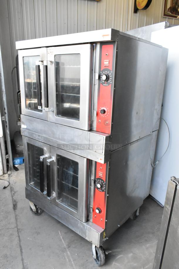 Two Vulcan VC4GD stainless steel gas convection ovens with view-through doors, metal racks, thermostatic controls, on casters.