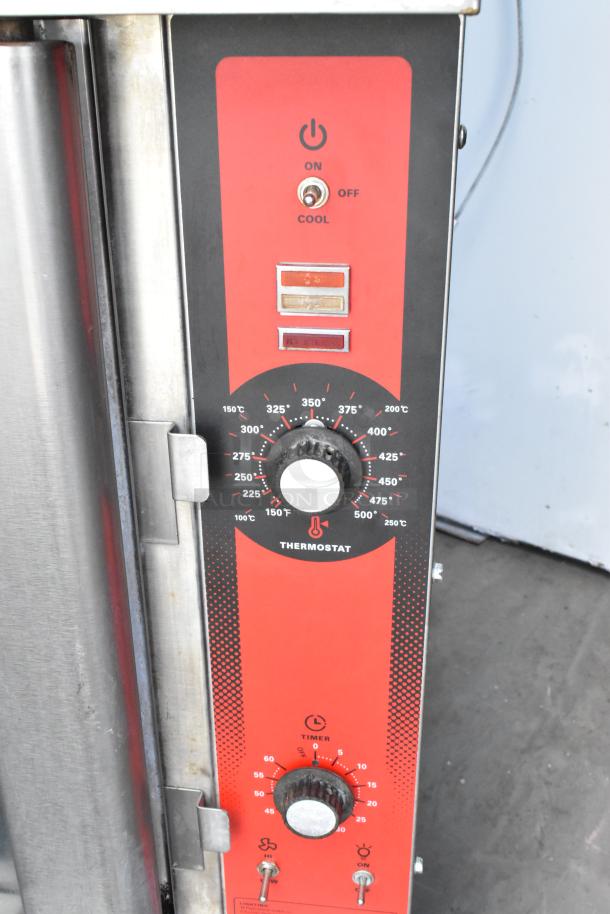 Vulcan VC4GD commercial gas convection oven controls; red panel with thermostat and timer dials.