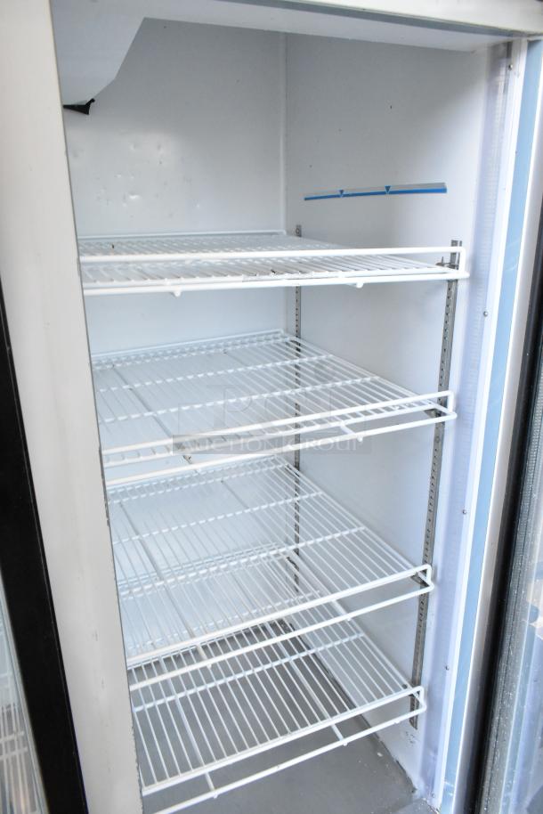 Kool-It KGF-72 commercial 3-door cooler, metal frame, poly coated racks, 115 volts, 1 phase, good condition.