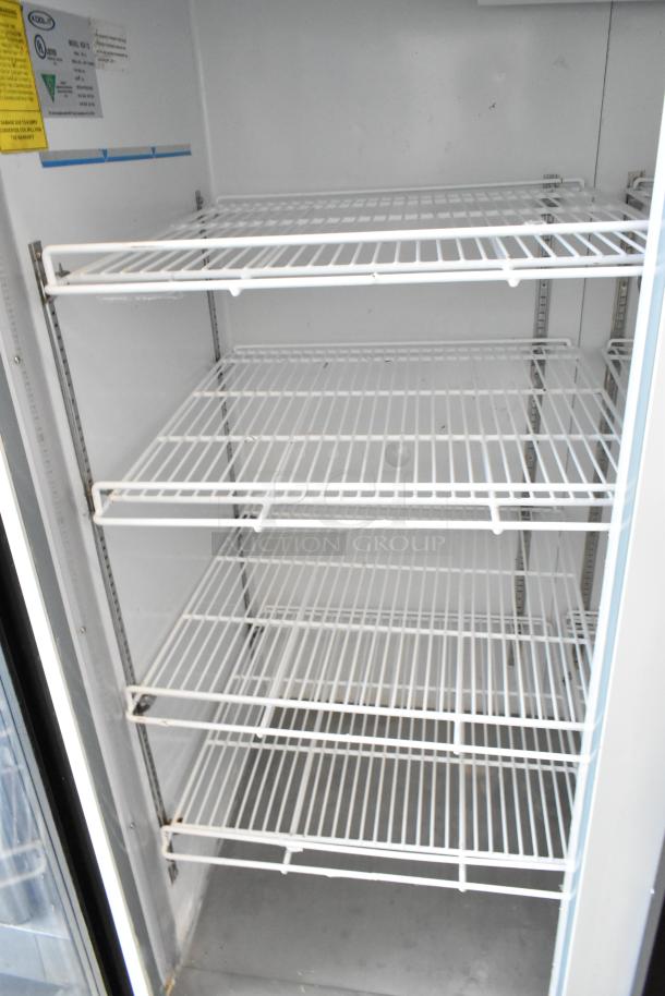 Kool-It KGF-72 commercial 3-door cooler, metal frame, poly-coated racks, 115 volts, 1 phase. Clean interior.