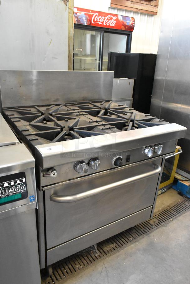 Southbend 4367A stainless steel 4-burner range with convection oven, natural gas powered, on commercial casters.
