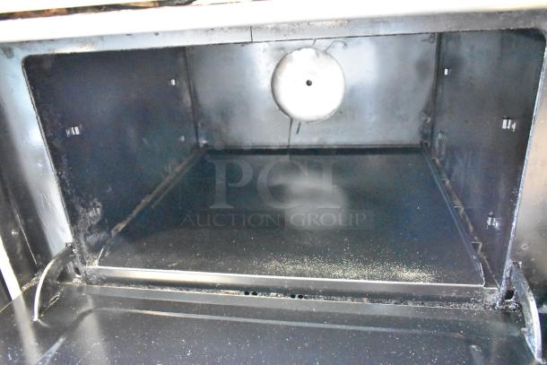 Southbend 4367A convection oven interior with stainless steel finish. Clean condition, built-in light socket visible.