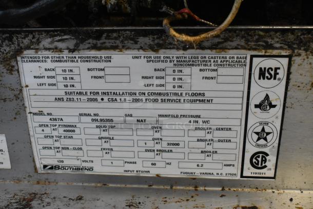 Southbend 4367A commercial stainless steel 4-burner range with convection oven. Natural gas. On casters. Model label visible.