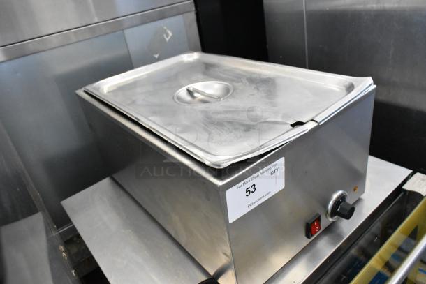 SEJ8000C stainless steel countertop food warmer, 120 volts, 1 phase. Features a secure lid and visible auction tag number 53.