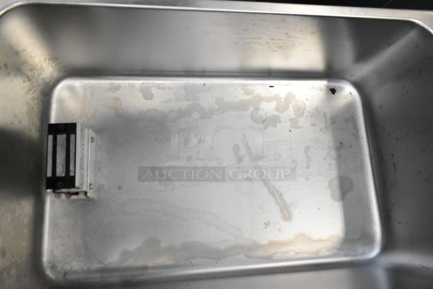 SEJ8000C stainless steel commercial food warmer, countertop model. Visible wear inside, designed for 120 volts, 1 phase.