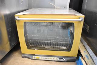 Cadco Unox stainless steel commercial convection oven, electric, 208/240V, countertop model, visible control panel, used.