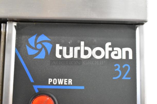 Moffat E89AMS Turbofan 32 convection oven label with logo, stainless steel surface, and power indicator.