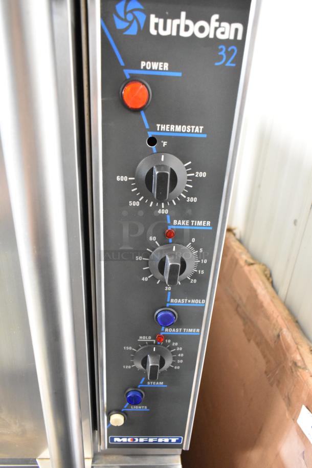 Moffat E89AMS Turbofan 32 convection oven controls with thermostat, timers, and lights on stainless steel panel.