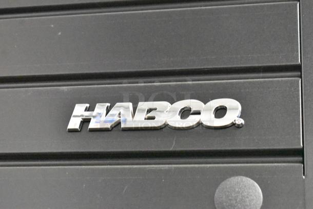 2019 Habco SE18 metal commercial cooler, single door, visible glass damage, 115V, 1 phase, Habco logo.