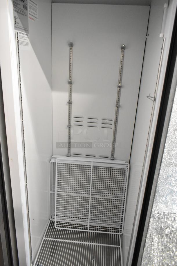 2019 Habco SE18 Reach In Cooler, single door, metal construction. Visible glass damage, 115 Volts, 1 Phase.