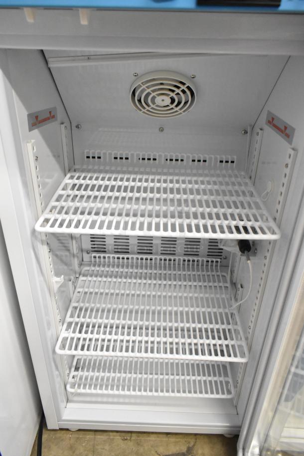 2019 Accucold ARG3PV metal mini cooler merchandiser, 115V, 1 phase. Features wire shelves and internal fan. Excellent condition.