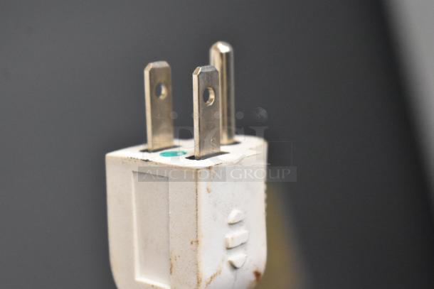 Close-up of plug for Accucold ARG3PV Mini Cooler Merchandiser, 115 Volts, 1 Phase. Visible markings and slight wear.