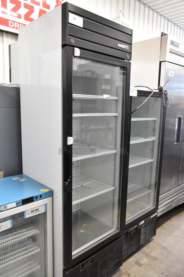 2019 Habco SE18 commercial single door cooler with poly-coated racks, black frame, 115 volts, 1 phase, excellent condition.
