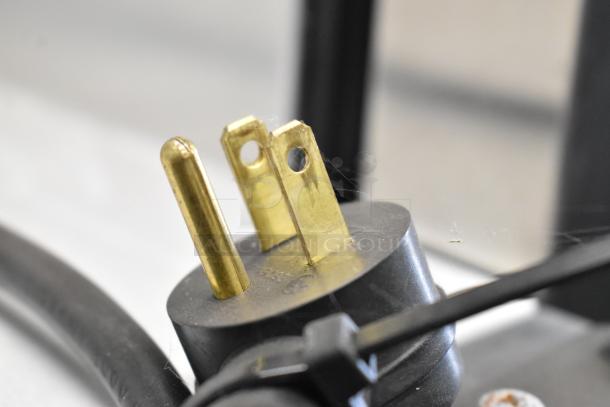 Close-up of a power plug from the Habco SE12 cooler, showing standard 115V, 1 phase electrical prongs.