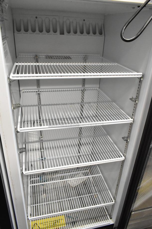 Habco SE12 commercial single door reach-in cooler with poly coated racks, metal construction, 115 volts, 1 phase, clean condition.