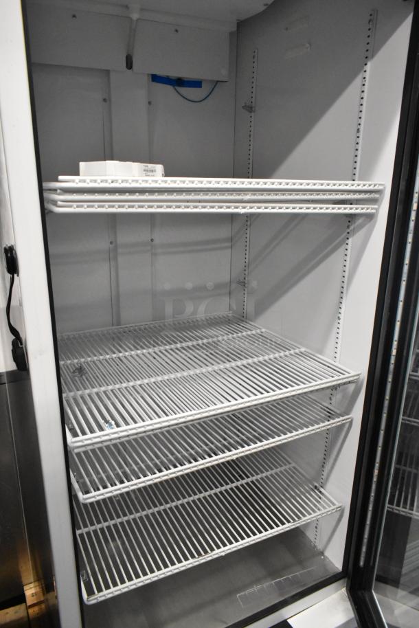 2021 True TSCI-600R-G-PH commercial reach-in cooler, single door, metal, with poly-coated racks, 115 volts, 1 phase.