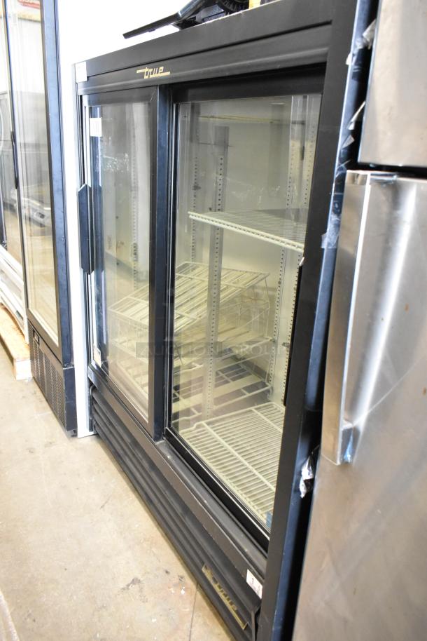 True GDM-41SL-54-LD 2-door reach-in cooler merchandiser with poly-coated racks; 115V, 1 phase; clean condition.